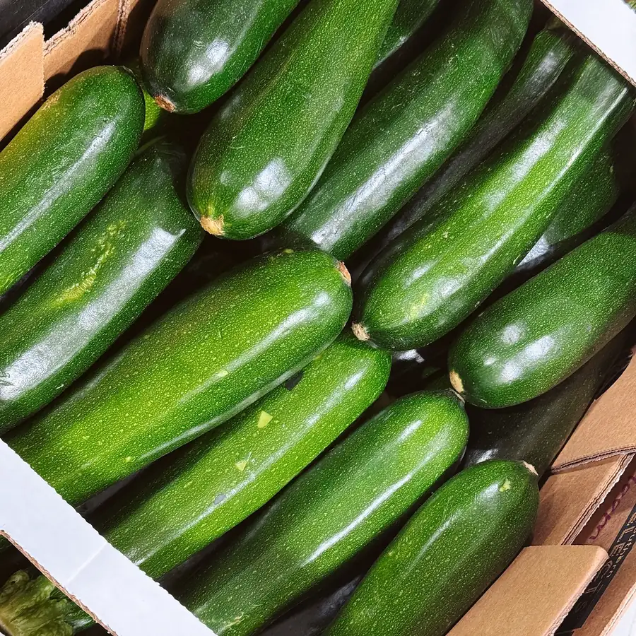 A box of dark green zucchini